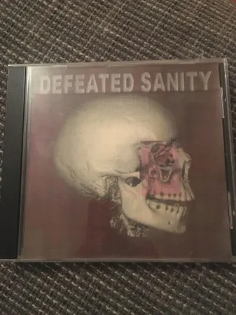 Tumor Hits — Defeated Sanity